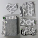 Several accessories available in owl blanket including bib, lovie, and burp cloth